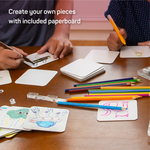 Load image into Gallery viewer, Two kids drawing on paperboard. Text which reads &quot;Create your own pieces with included paperboard&quot;

