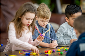 Group of kids making a craft