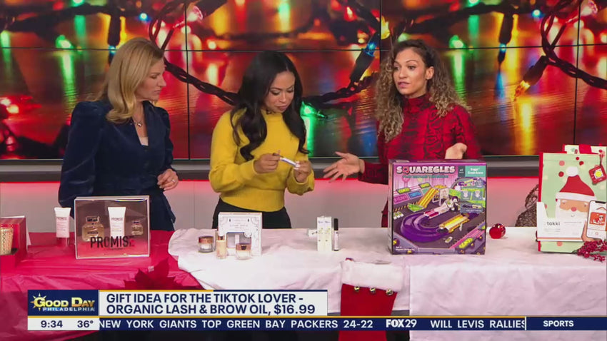 Three women on Fox news segment talking with products on table and holiday decor in the backround.